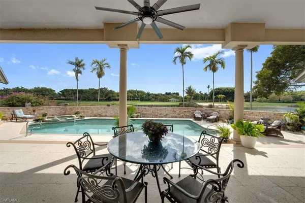 a view of a swimming pool with a patio