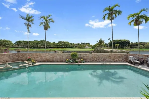 a view of a swimming pool with a patio