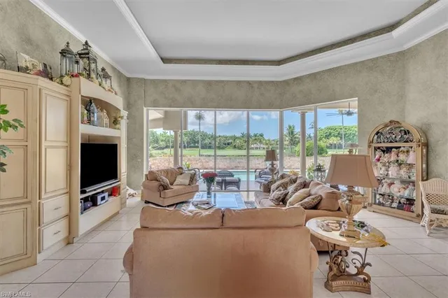 a living room with fireplace furniture and a flat screen tv