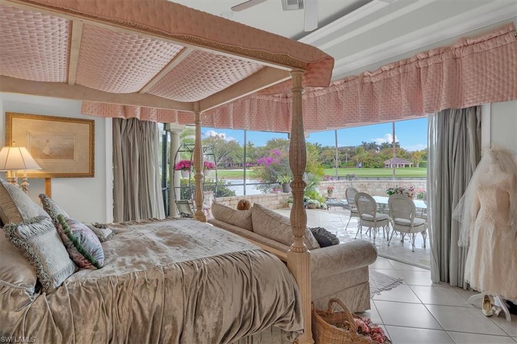 2339 Alexander Palm Naples, FL 34105 - Photo 35 of 45 a bed sitting in a spacious bedroom next to a window