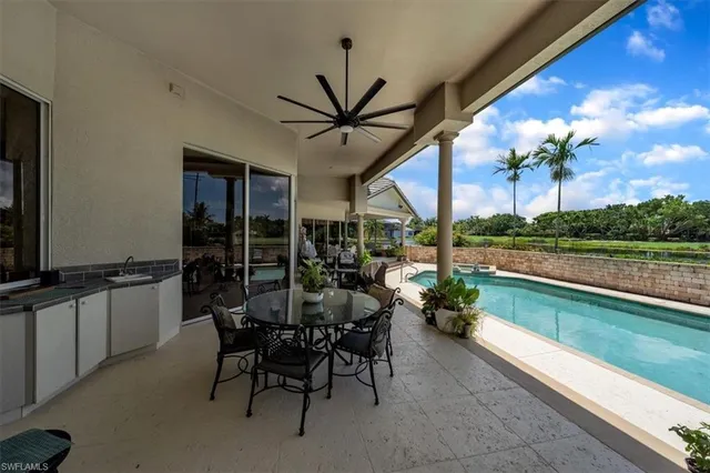 a dining room with furniture and garden view