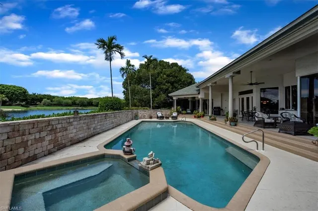 a view of a swimming pool with a patio