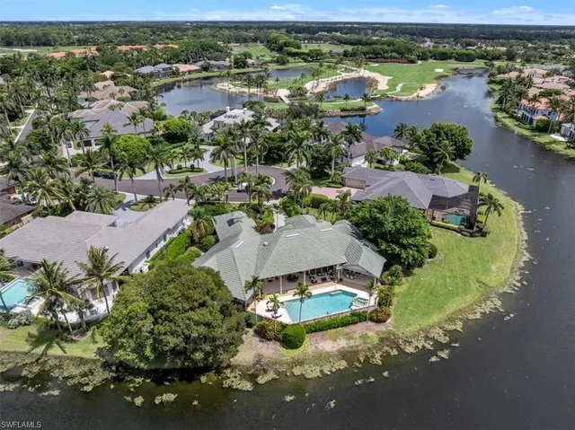 an aerial view of a houses with a lake view