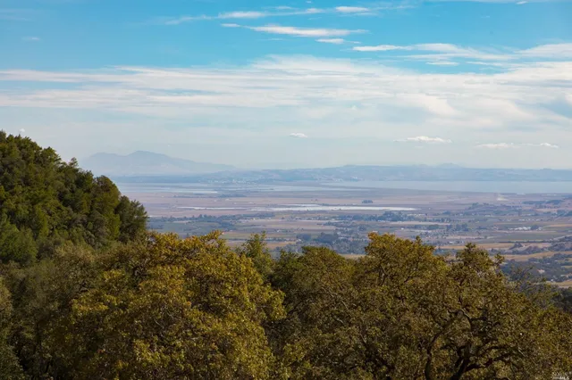 a view of a large body of water and mountain