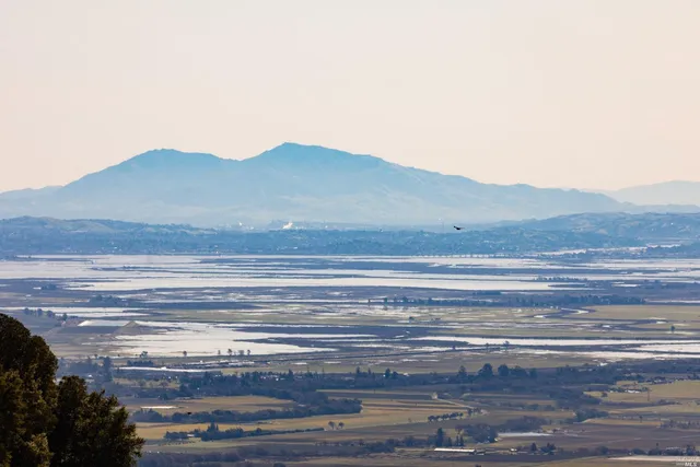a view of a house with a mountain
