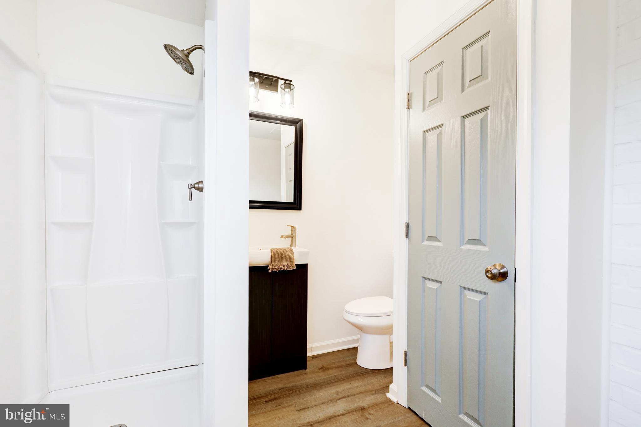 31 Nature Lane Levittown, PA 19054 - Photo 12 of 33 a bathroom with a toilet sink and shower