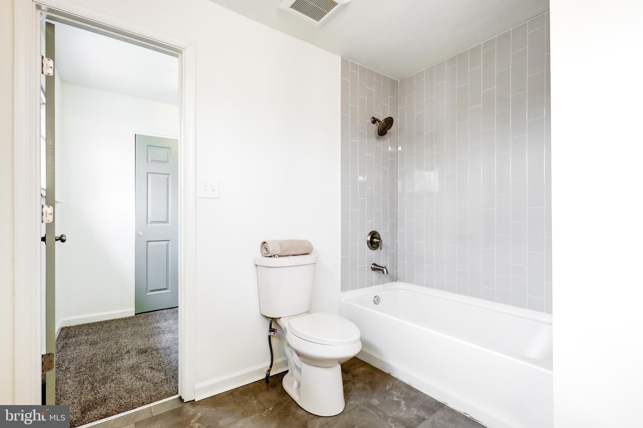 31 Nature Lane Levittown, PA 19054 - Photo 22 of 33 a bathroom with a toilet and a bathtub