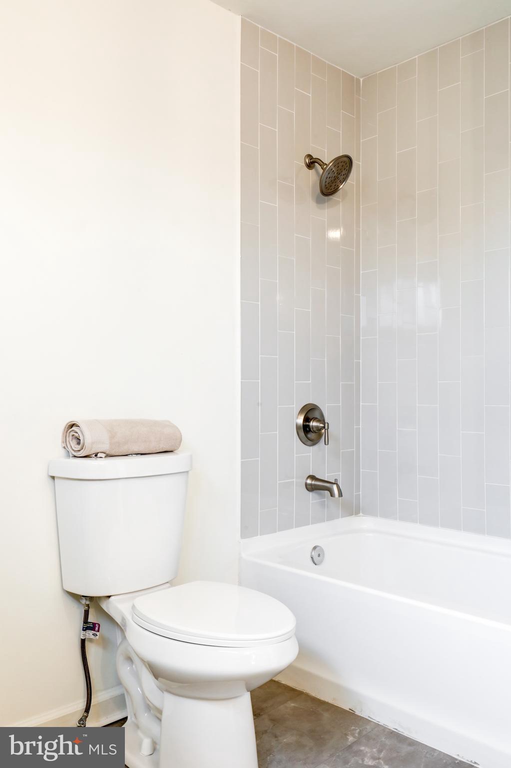31 Nature Lane Levittown, PA 19054 - Photo 23 of 33 a bathroom with a toilet a sink and bathtub