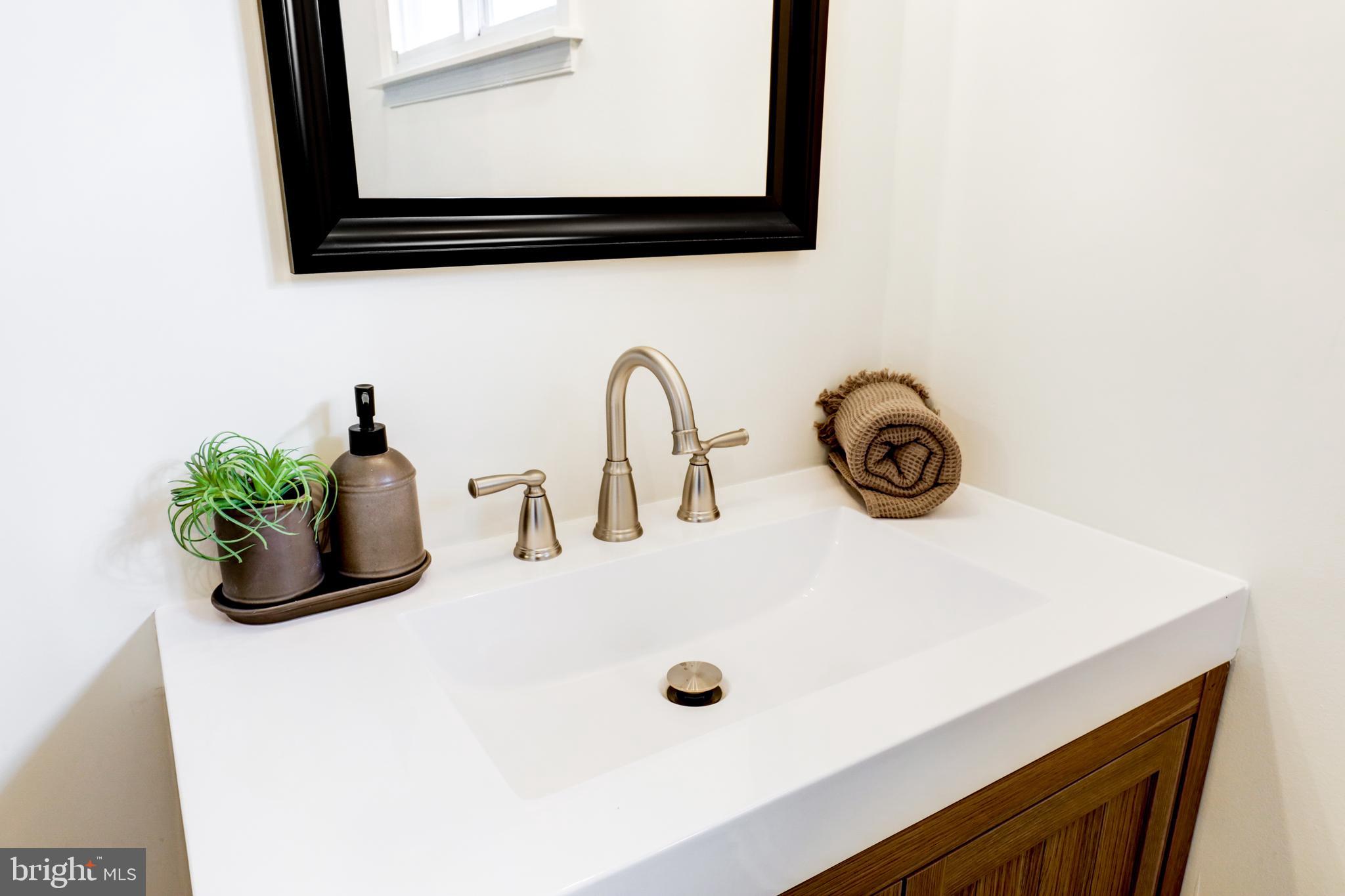 31 Nature Lane Levittown, PA 19054 - Photo 24 of 33 a bathroom with a sink and a mirror