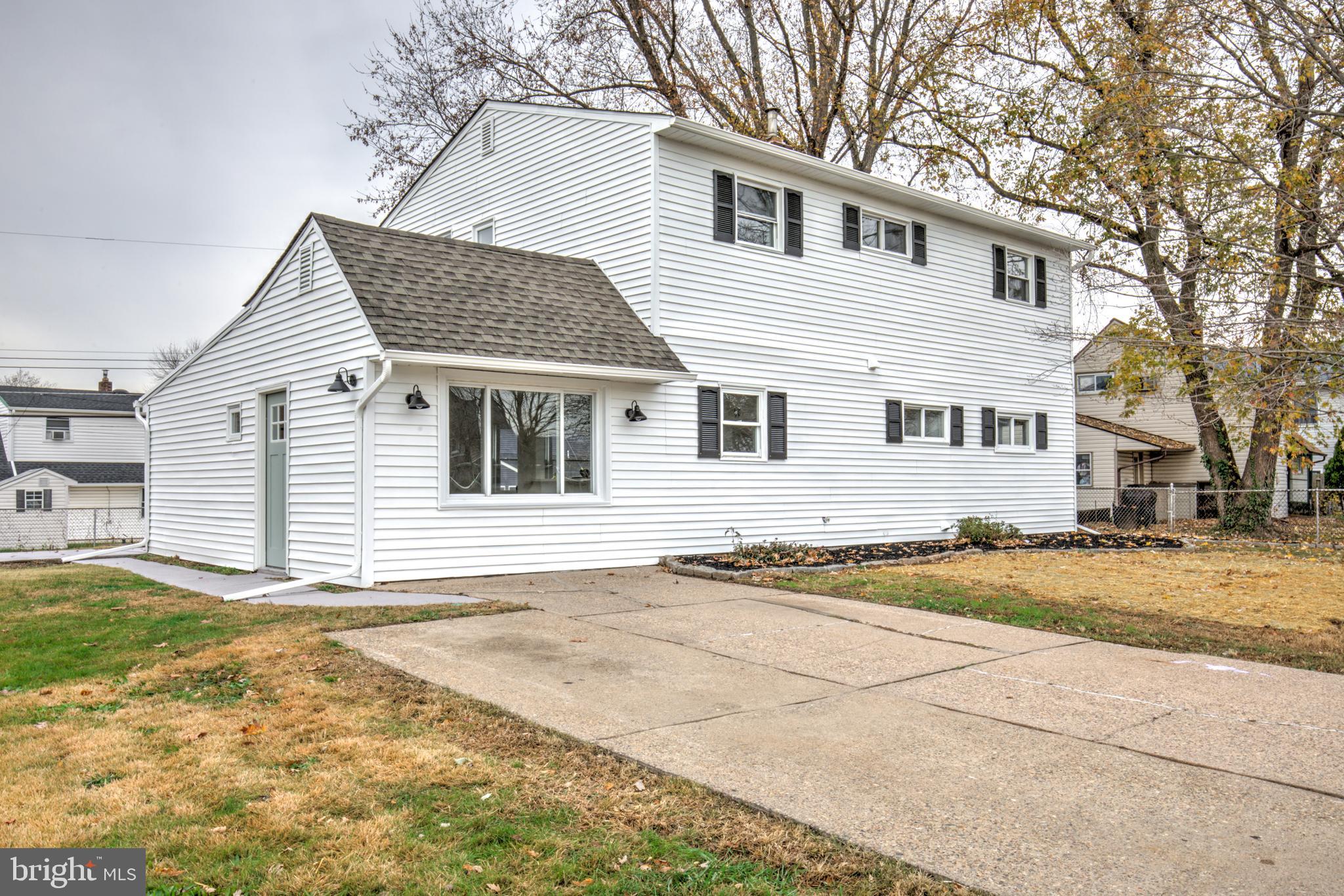 31 Nature Lane Levittown, PA 19054 - Photo 29 of 33 a view of a white house with a large space in front of it