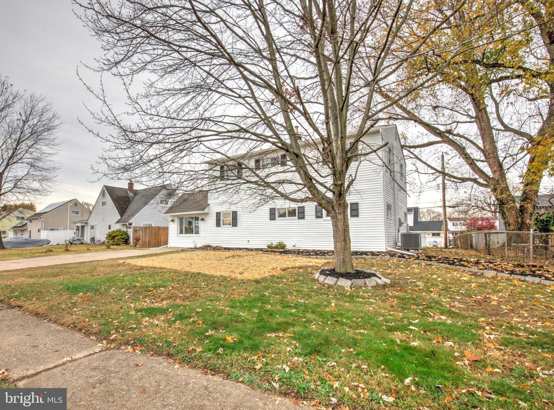 31 Nature Lane Levittown, PA 19054 - Photo 31 of 33 a front view of a house with a yard covered with snow