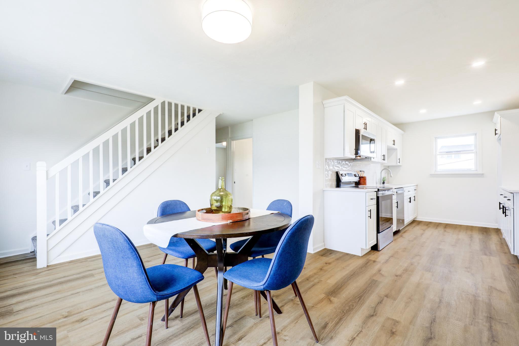 31 Nature Lane Levittown, PA 19054 - Photo 10 of 33 a view of a dining room with furniture and wooden floor