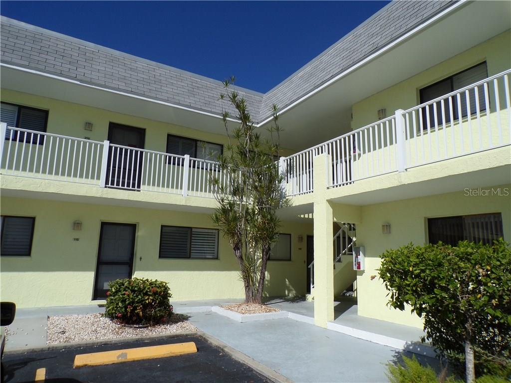 6703 Midnight Pass Road, Unit 215 Sarasota, FL 34242 - Photo 1 of 1 a front view of a house
