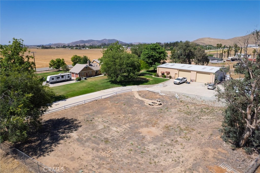 34150 Stowe Road Winchester, CA 92545 - Photo 5 of 80 a view of a terrace with a garden and mountain view