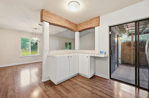 wooden floor in an empty room and a window