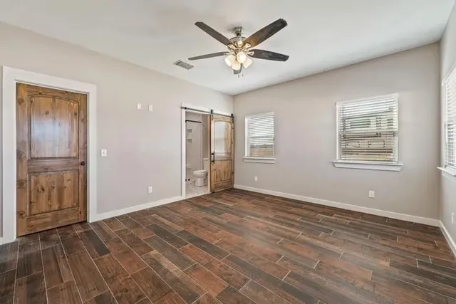 a view of an empty room with a window