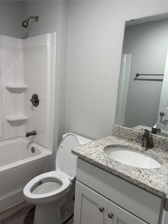 514 2nd Street Southwest Fort Meade, FL 33841 - Photo 13 of 21 a bathroom with a granite countertop sink toilet and shower