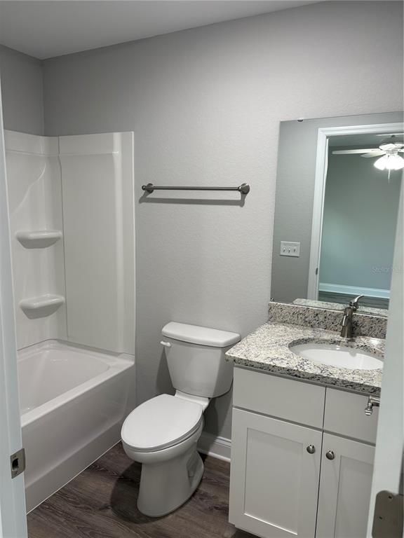 514 2nd Street Southwest Fort Meade, FL 33841 - Photo 15 of 21 a bathroom with a granite countertop sink toilet and shower