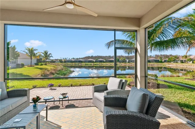 a view of swimming pool with outdoor seating and a yard