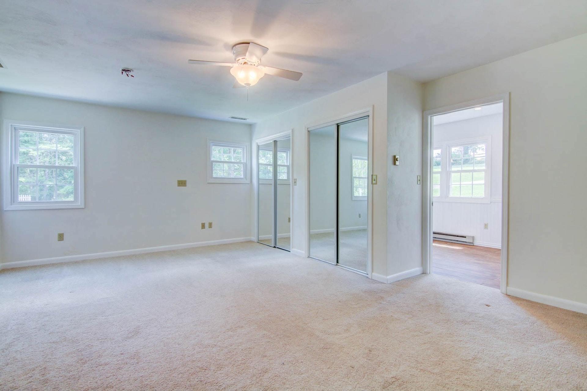 580 Mt Pleasant Church Road Fincastle, VA 24090 - Photo 11 of 39 an empty room with fan and windows