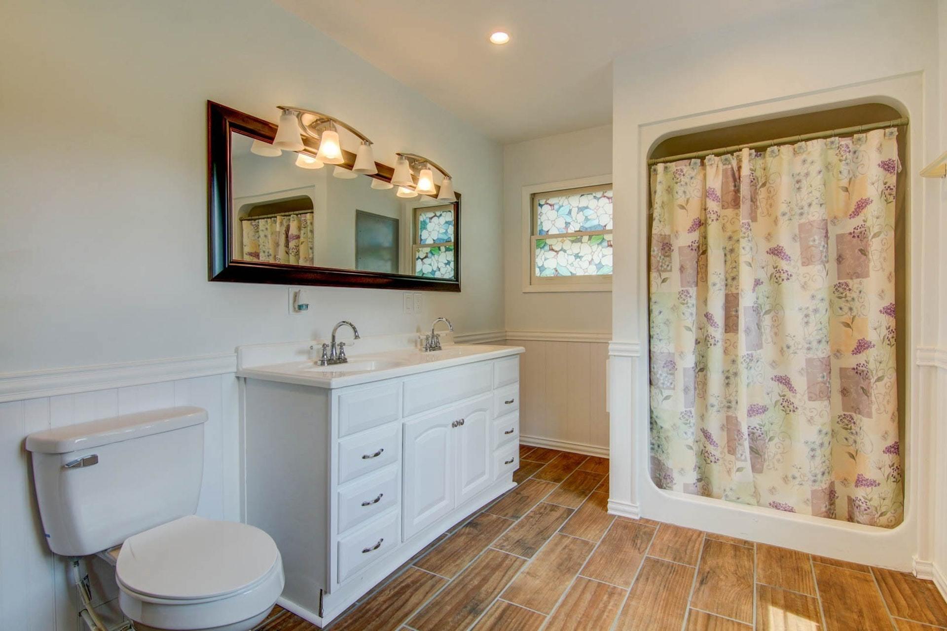 580 Mt Pleasant Church Road Fincastle, VA 24090 - Photo 13 of 39 a bathroom with a double vanity sink toilet and a mirror
