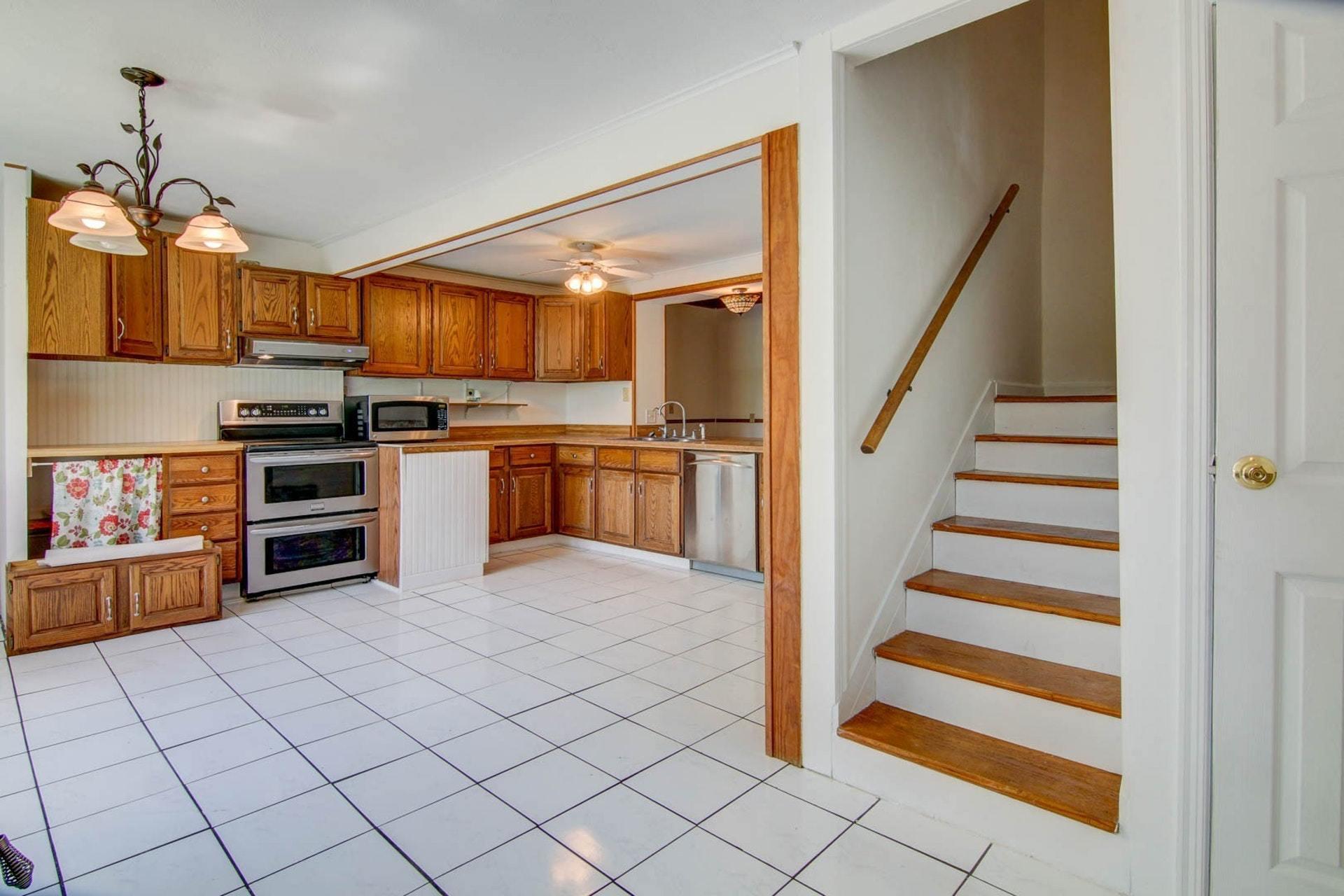 580 Mt Pleasant Church Road Fincastle, VA 24090 - Photo 3 of 39 a kitchen with stainless steel appliances granite countertop a sink and cabinets