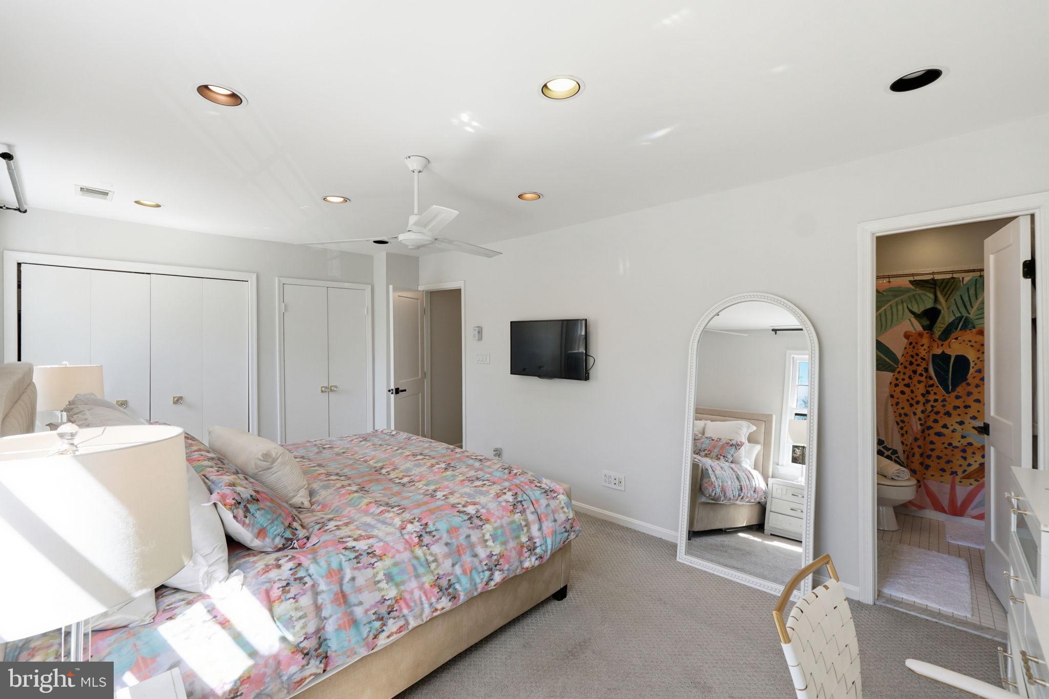 3523 Hamlet Place, Unit 501 Chevy Chase, MD 20815 - Photo 15 of 37 a bedroom with a bed and a couch