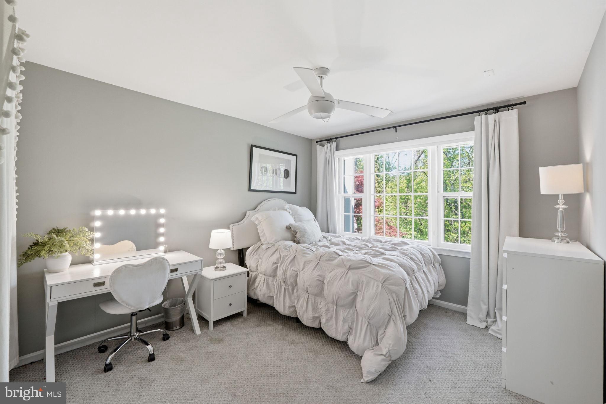 3523 Hamlet Place, Unit 501 Chevy Chase, MD 20815 - Photo 20 of 37 a bed room with a bed and a table