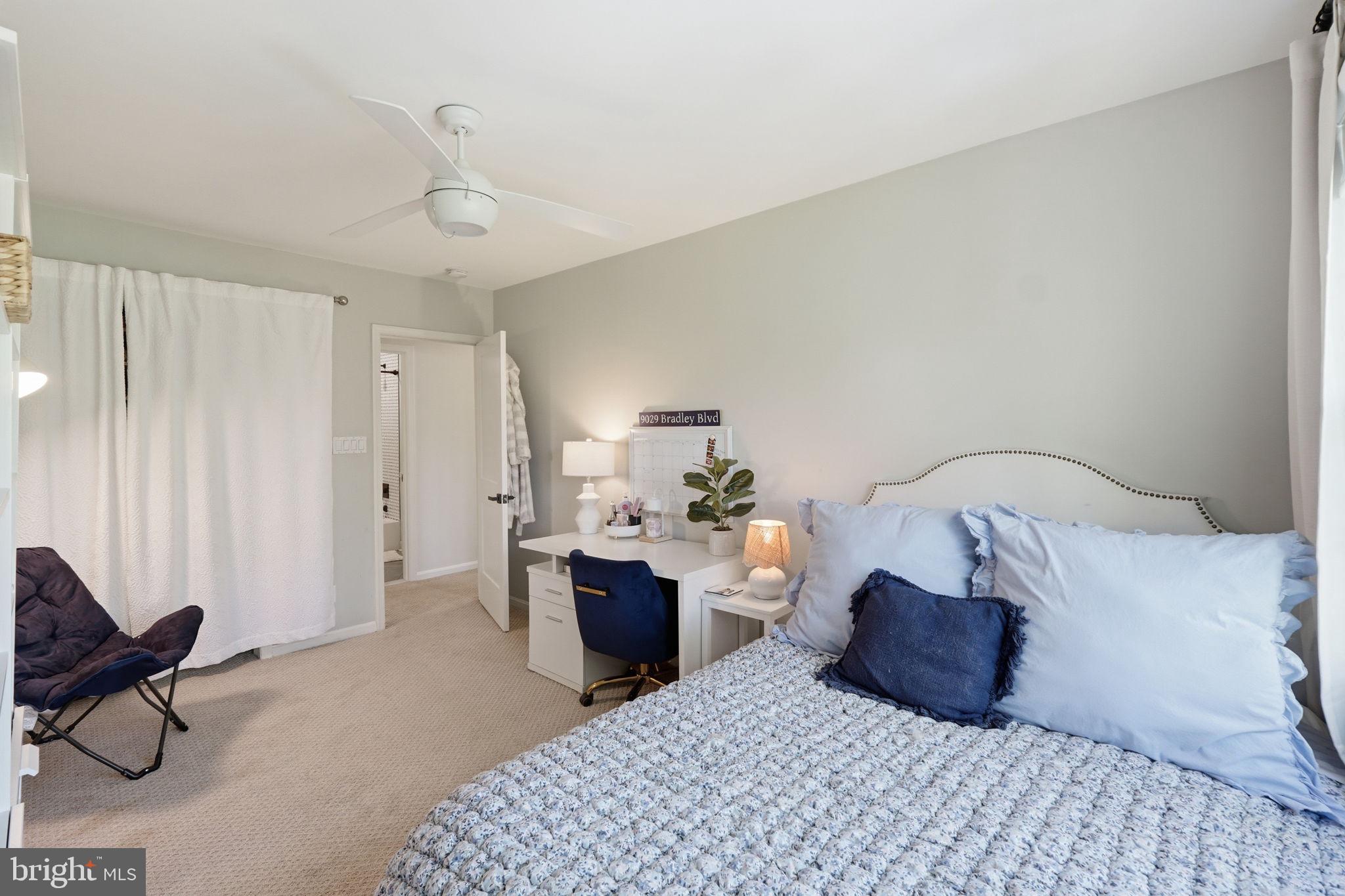 3523 Hamlet Place, Unit 501 Chevy Chase, MD 20815 - Photo 23 of 37 a bedroom with a bed and a chandelier