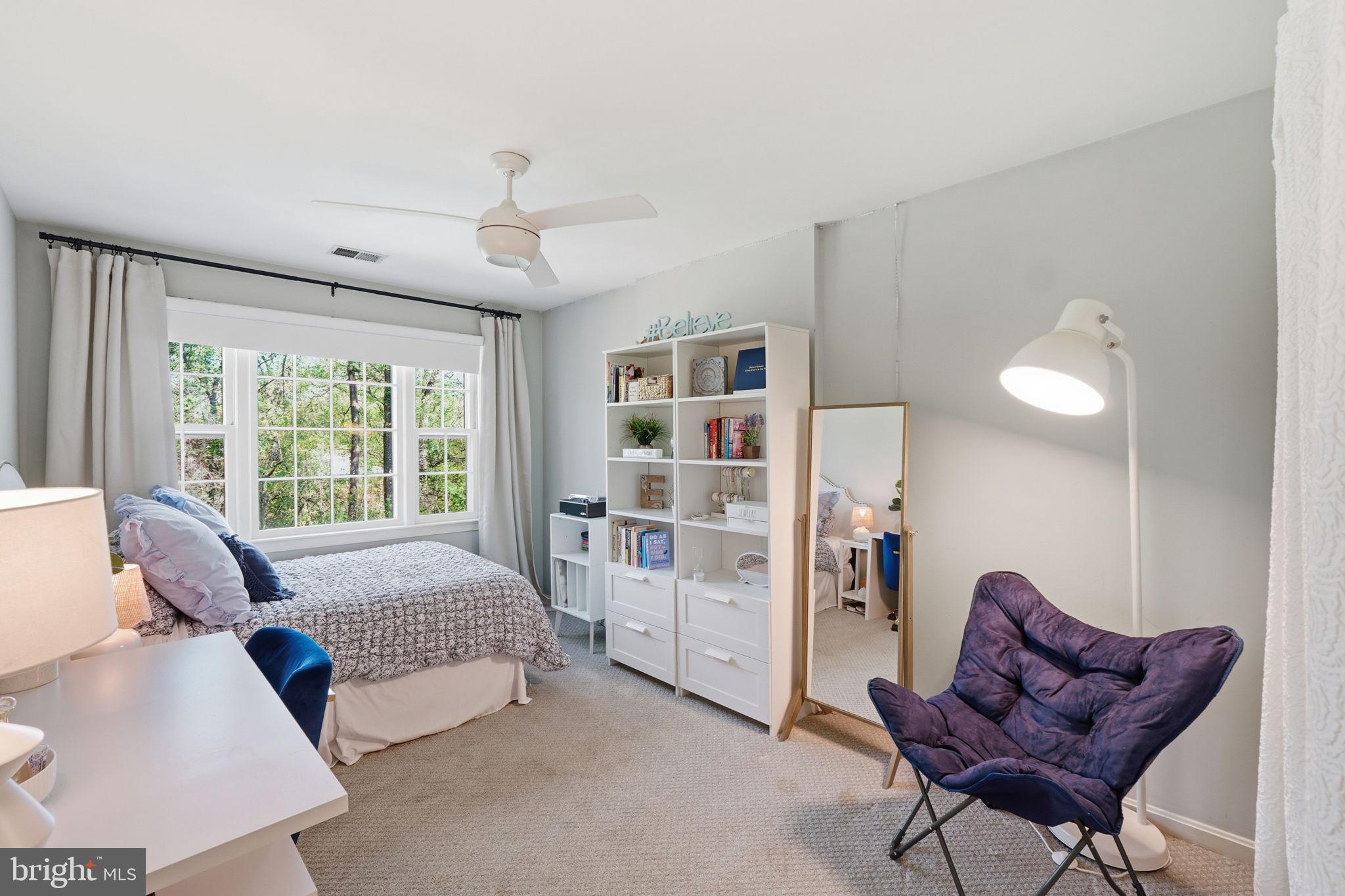 3523 Hamlet Place, Unit 501 Chevy Chase, MD 20815 - Photo 24 of 37 a spacious bedroom with a bed and a couch