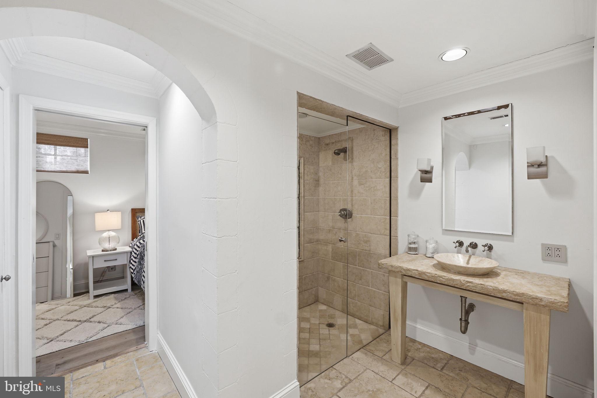 3523 Hamlet Place, Unit 501 Chevy Chase, MD 20815 - Photo 30 of 37 a bathroom with a sink a toilet and shower