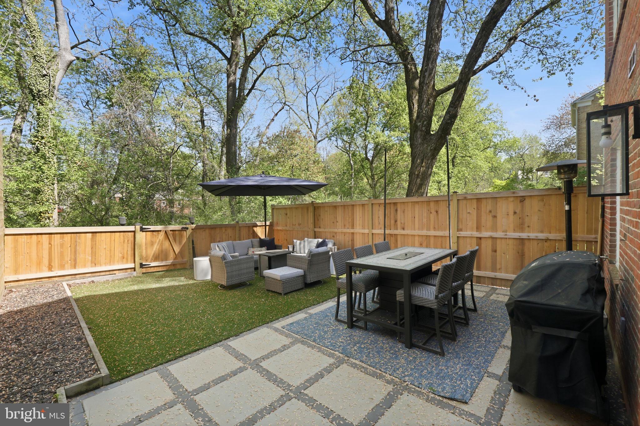 3523 Hamlet Place, Unit 501 Chevy Chase, MD 20815 - Photo 33 of 37 a view of backyard with seating space and trees around
