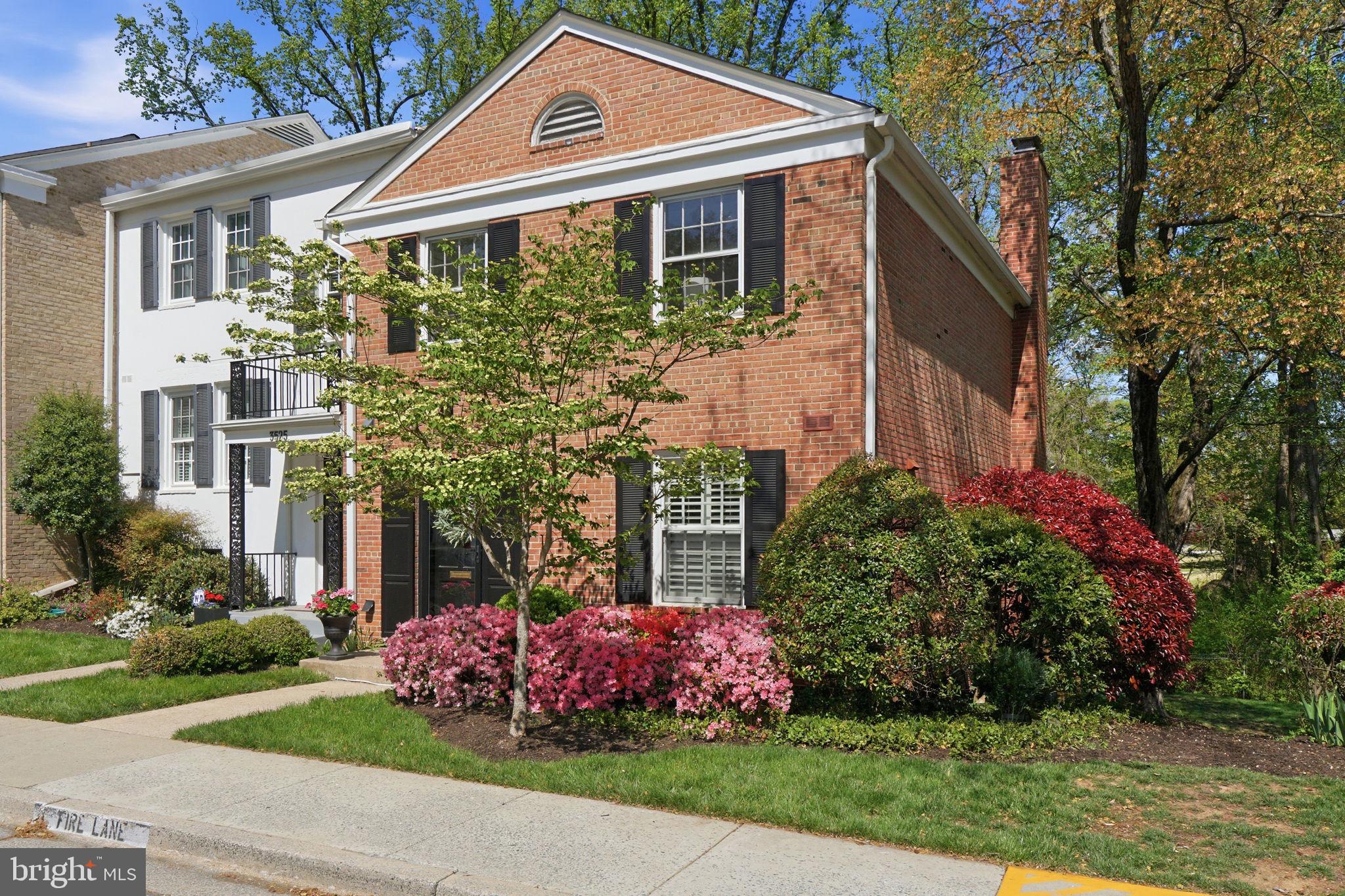 3523 Hamlet Place, Unit 501 Chevy Chase, MD 20815 - Photo 34 of 37 a front view of a house with garden