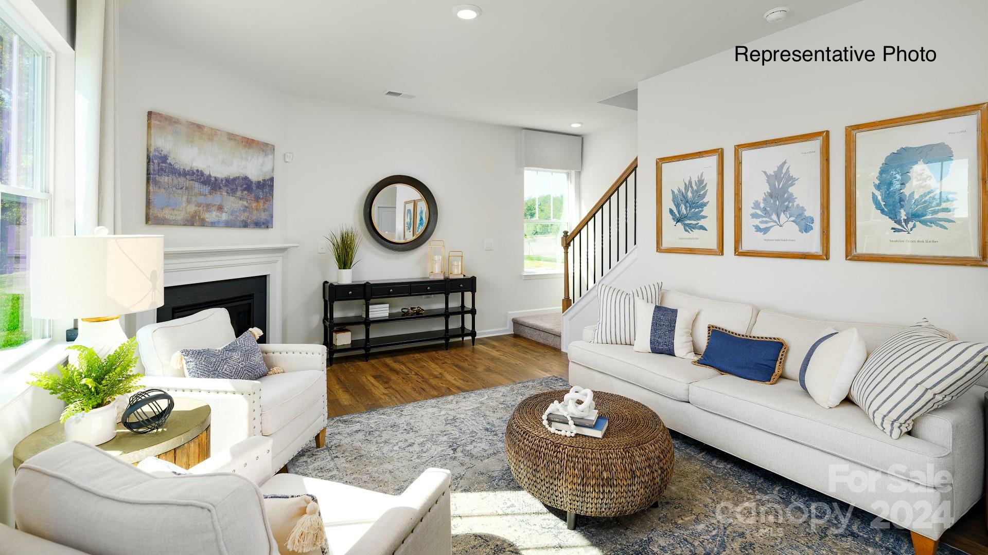 7922 Old Brk Road Sherrills Ford, NC 28673 - Photo 11 of 32 a living room with furniture a rug and a fireplace