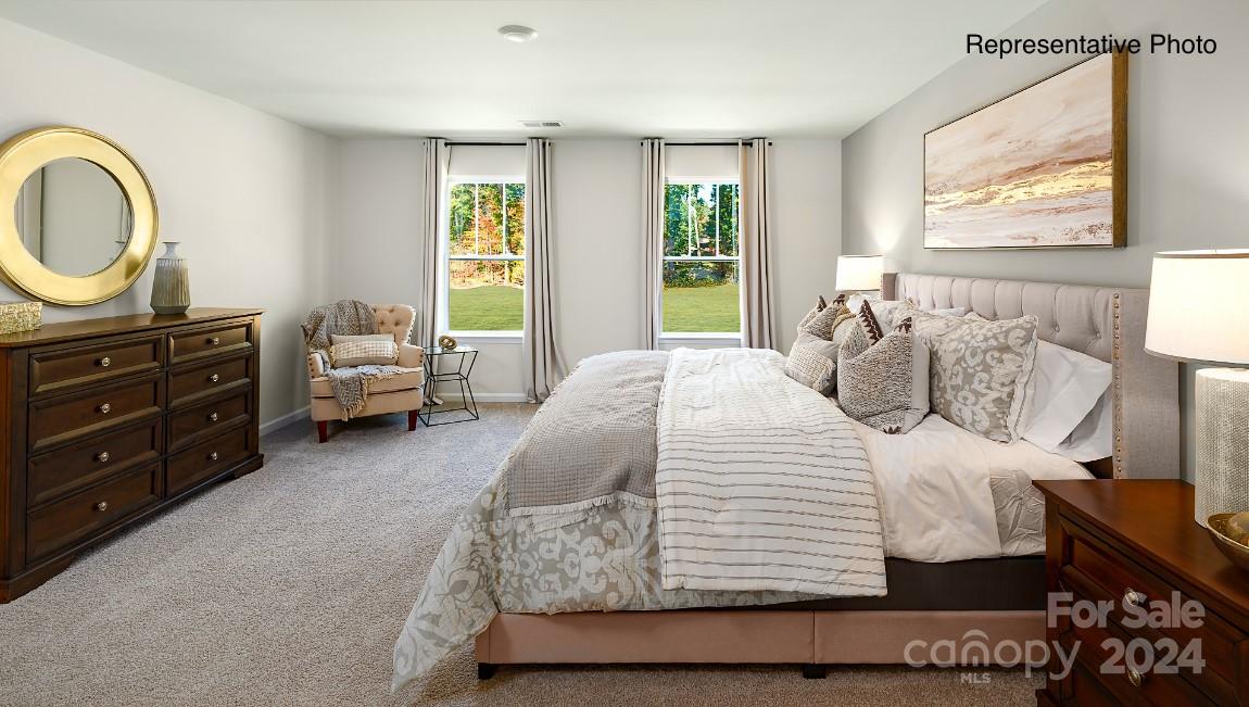 7922 Old Brk Road Sherrills Ford, NC 28673 - Photo 14 of 32 a bedroom with a bed a dresser next to a window