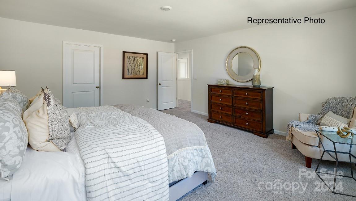 7922 Old Brk Road Sherrills Ford, NC 28673 - Photo 15 of 32 a bedroom with a bed and painting on the wall
