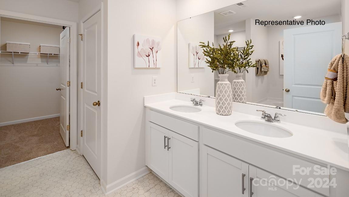 7922 Old Brk Road Sherrills Ford, NC 28673 - Photo 17 of 32 a bathroom with a double vanity sink and a mirror
