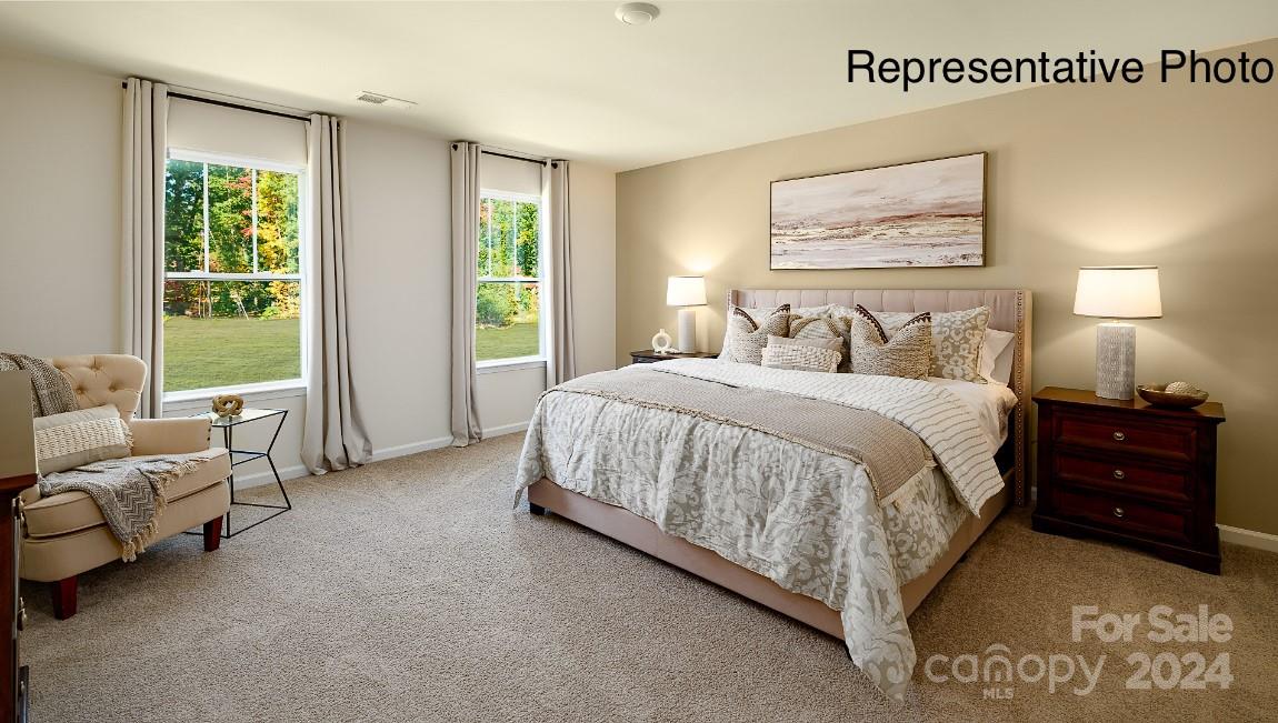 7922 Old Brk Road Sherrills Ford, NC 28673 - Photo 18 of 32 a spacious bedroom with a bed and a couch