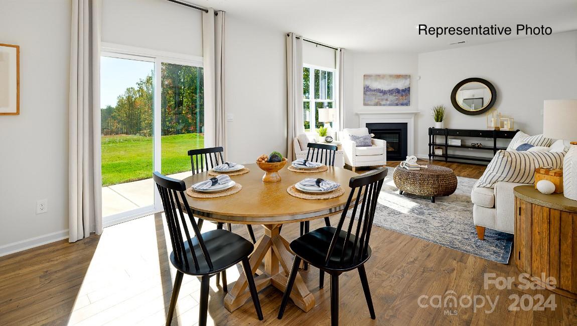 7922 Old Brk Road Sherrills Ford, NC 28673 - Photo 6 of 32 a view of a dining room with furniture window and wooden floor