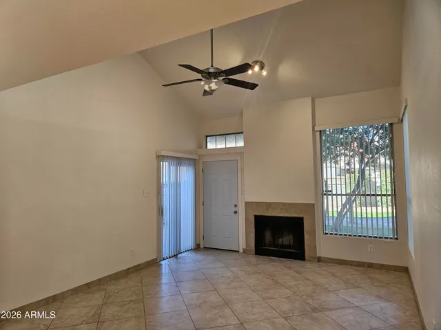 a view of a hallway with wooden floor and entryway