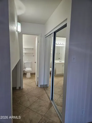 a view of a bathroom from a hallway