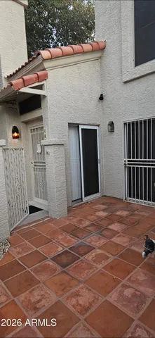 a view of a swimming pool with sitting area