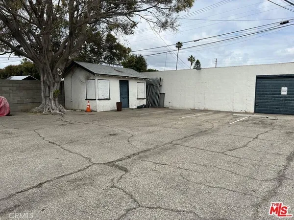 a view of a house with a tree and a garage