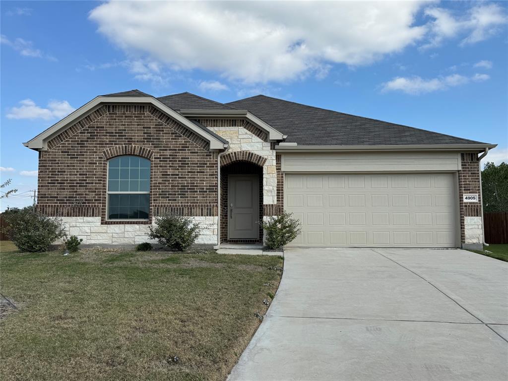 4905 Sagerun Drive Princeton, TX 75407 - Photo 1 of 25 a front view of a house with garden