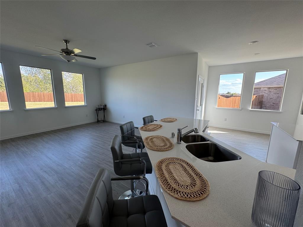 4905 Sagerun Drive Princeton, TX 75407 - Photo 13 of 25 a view of a workspace with furniture and a window