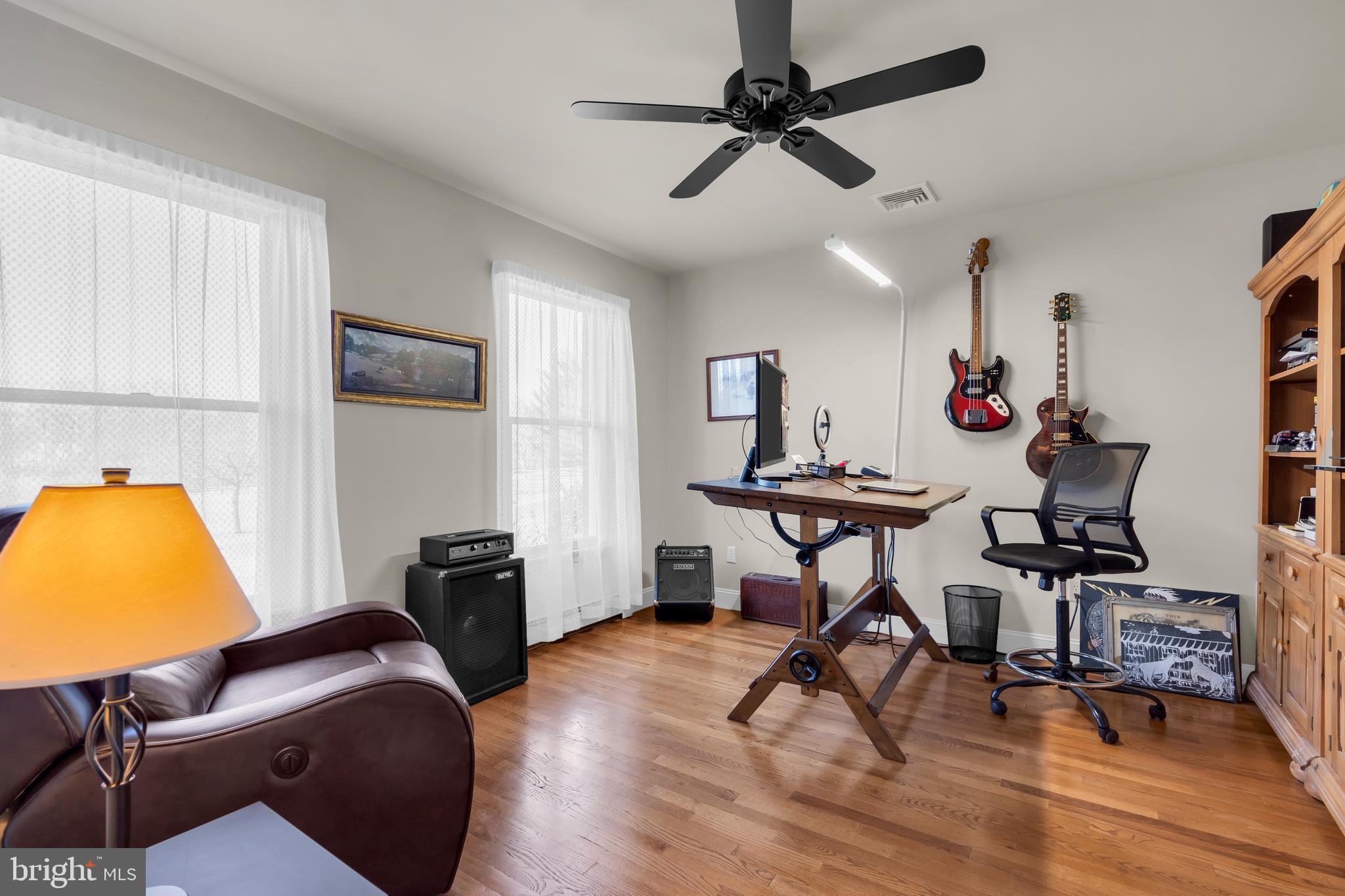 309 Pennington Harbourton Road Pennington, NJ 08534 - Photo 18 of 67 a view of a livingroom with furniture and a flat screen tv