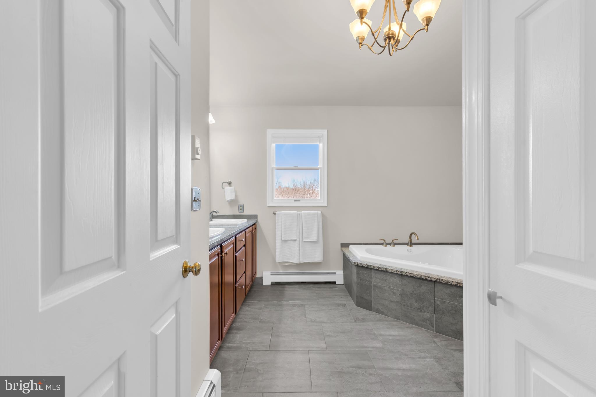 309 Pennington Harbourton Road Pennington, NJ 08534 - Photo 24 of 67 a bathroom with a sink a washer and dryer