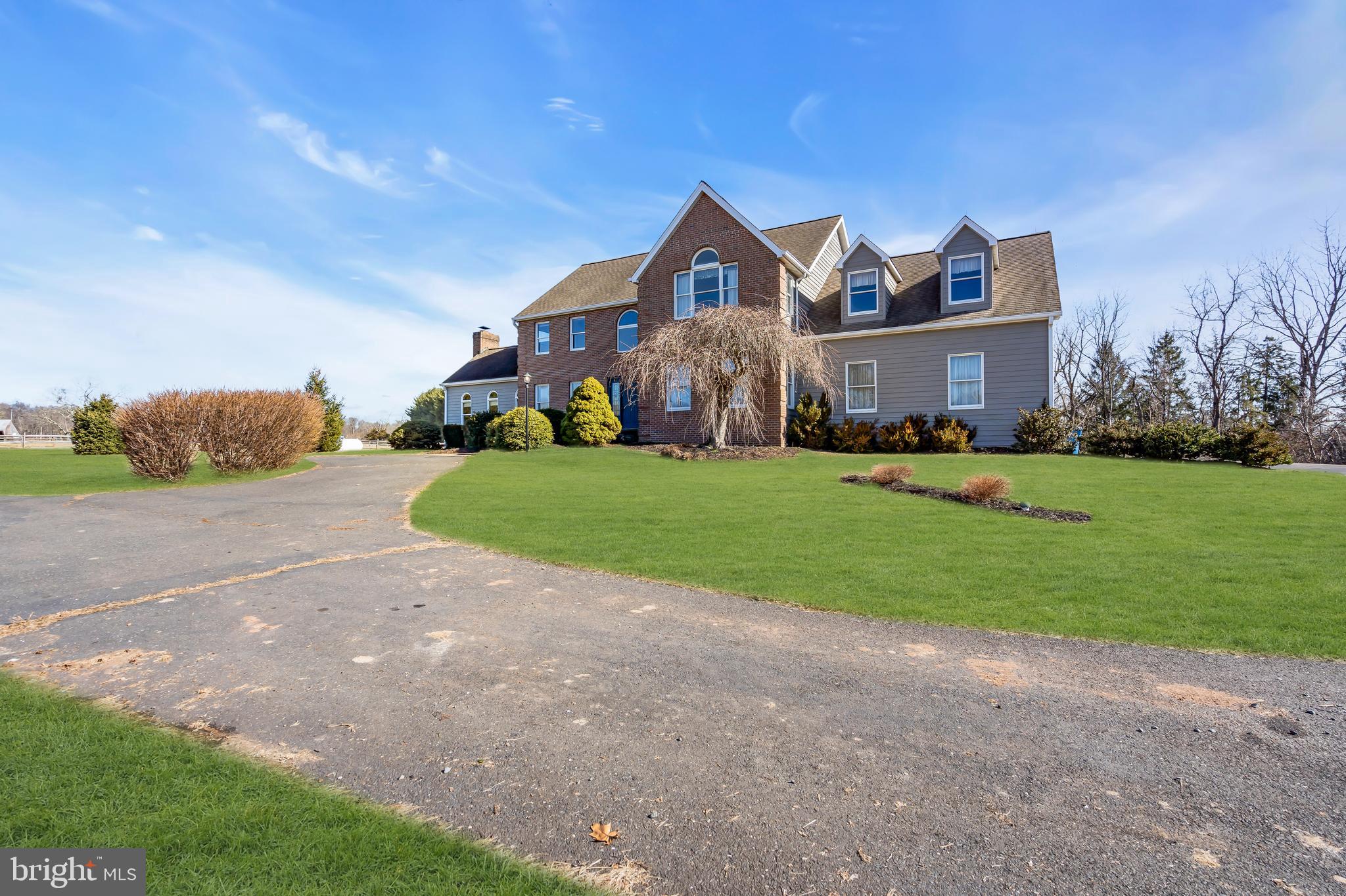 309 Pennington Harbourton Road Pennington, NJ 08534 - Photo 3 of 67 a view of a big house with a big yard and large trees