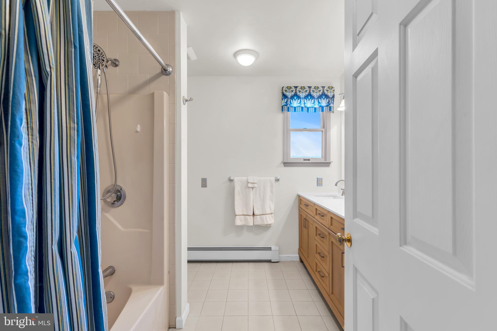 309 Pennington Harbourton Road Pennington, NJ 08534 - Photo 32 of 67 a bathroom with a bathtub and a shower