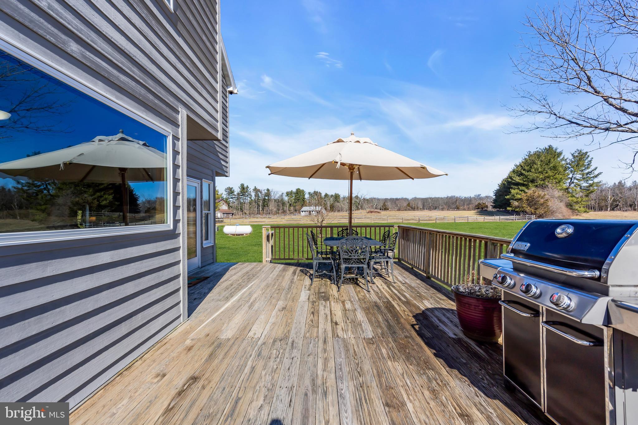 309 Pennington Harbourton Road Pennington, NJ 08534 - Photo 35 of 67 a view of a patio with a table chairs and a barbeque
